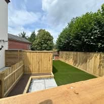 Completed garden transformation Suffolk — Finished garden transformation with new turf, fencing, and patio area