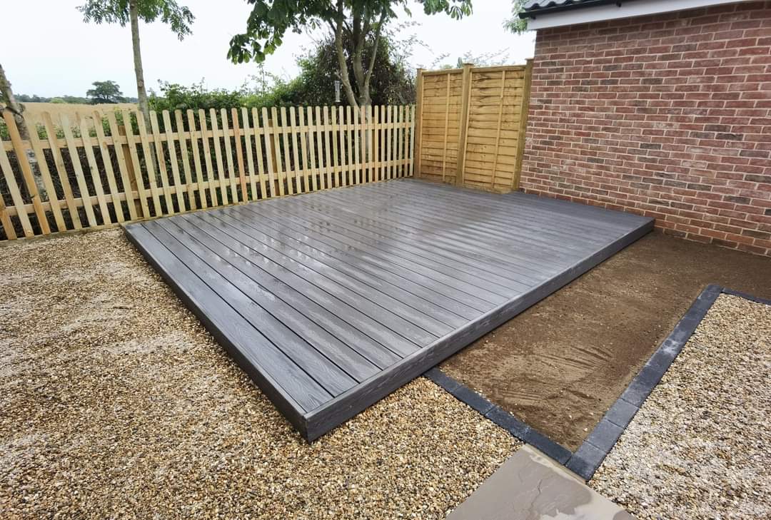 Decking installation Suffolk — Large composite decking platform with timber boards and edging