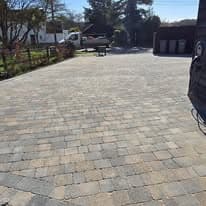 Driveway installation Suffolk — Block paved driveway with geometric pattern, residential setting