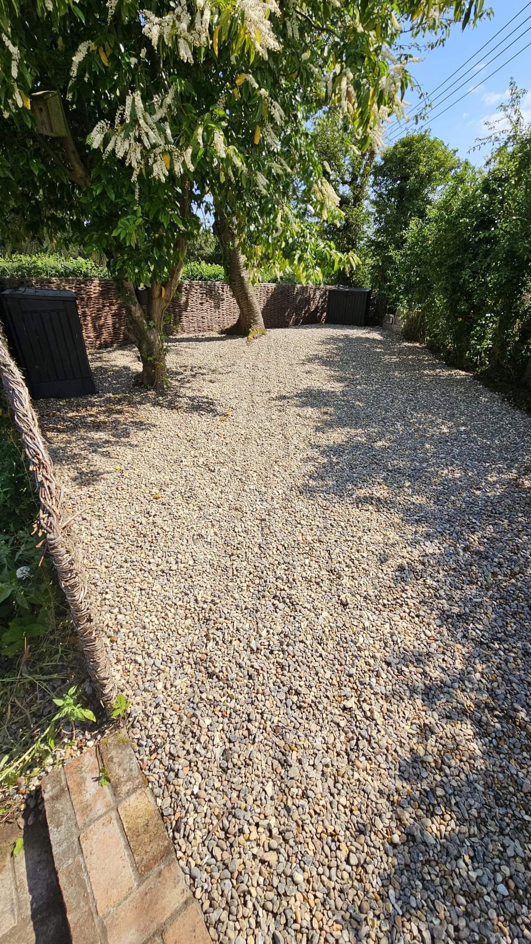 Driveway installation Suffolk — Gravel driveway with brick edging in enclosed courtyard space