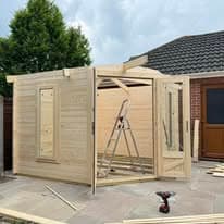 Fencing & gates Suffolk — Wooden fence panels under construction in driveway area