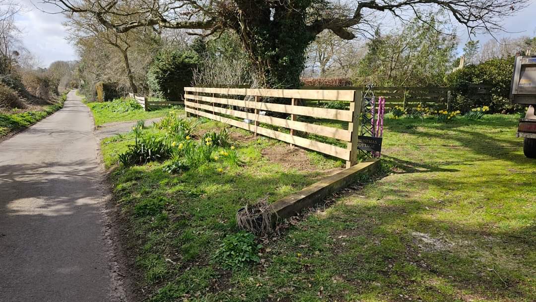 Fencing & gates Suffolk — Wooden five-bar farm gate fence alongside rural driveway entrance