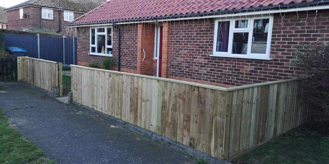 Fencing & gates Suffolk — Wooden fence installation along front of residential property