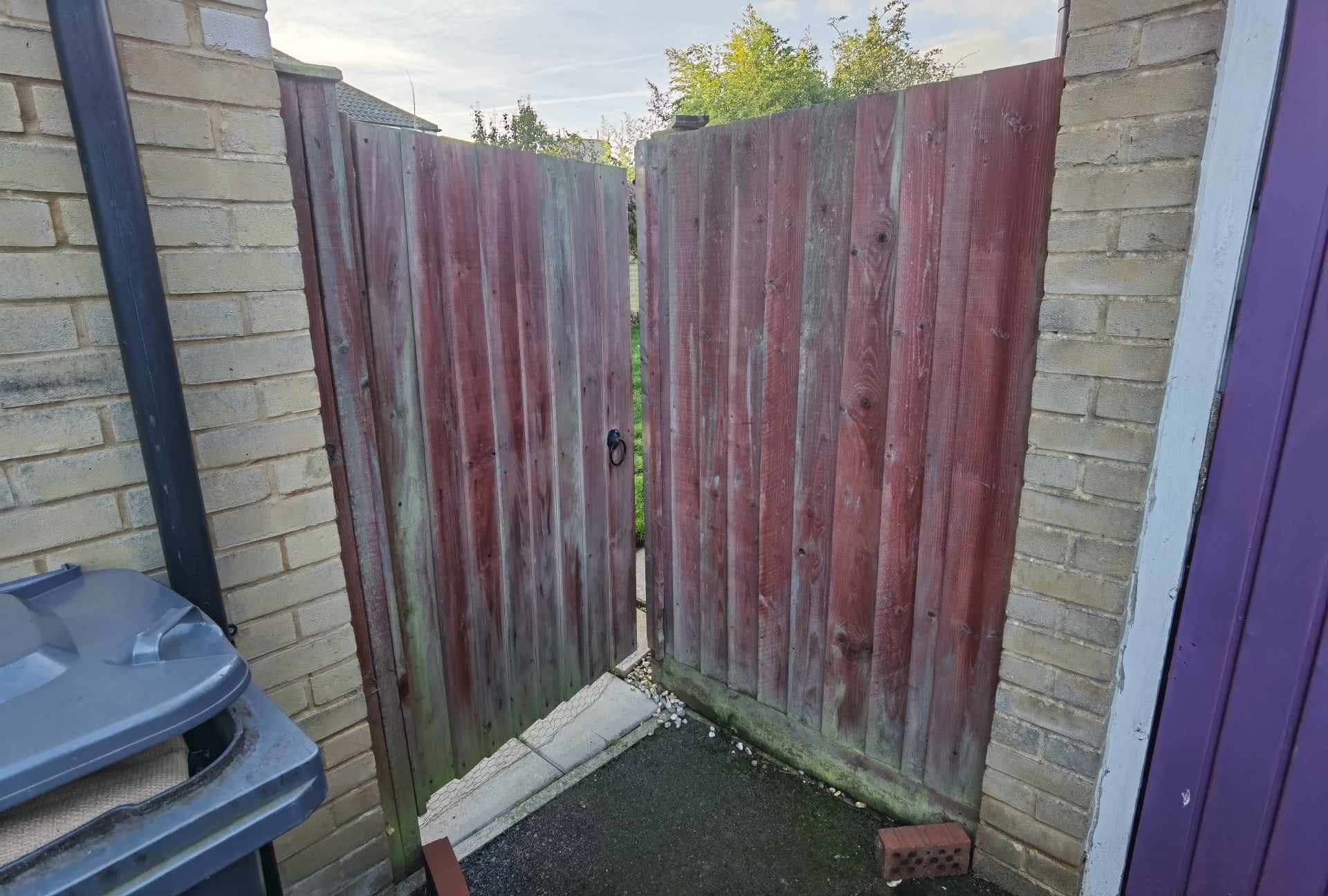Fencing & gates Suffolk — Wooden fence panels with visible wear and weathering, gate number 6