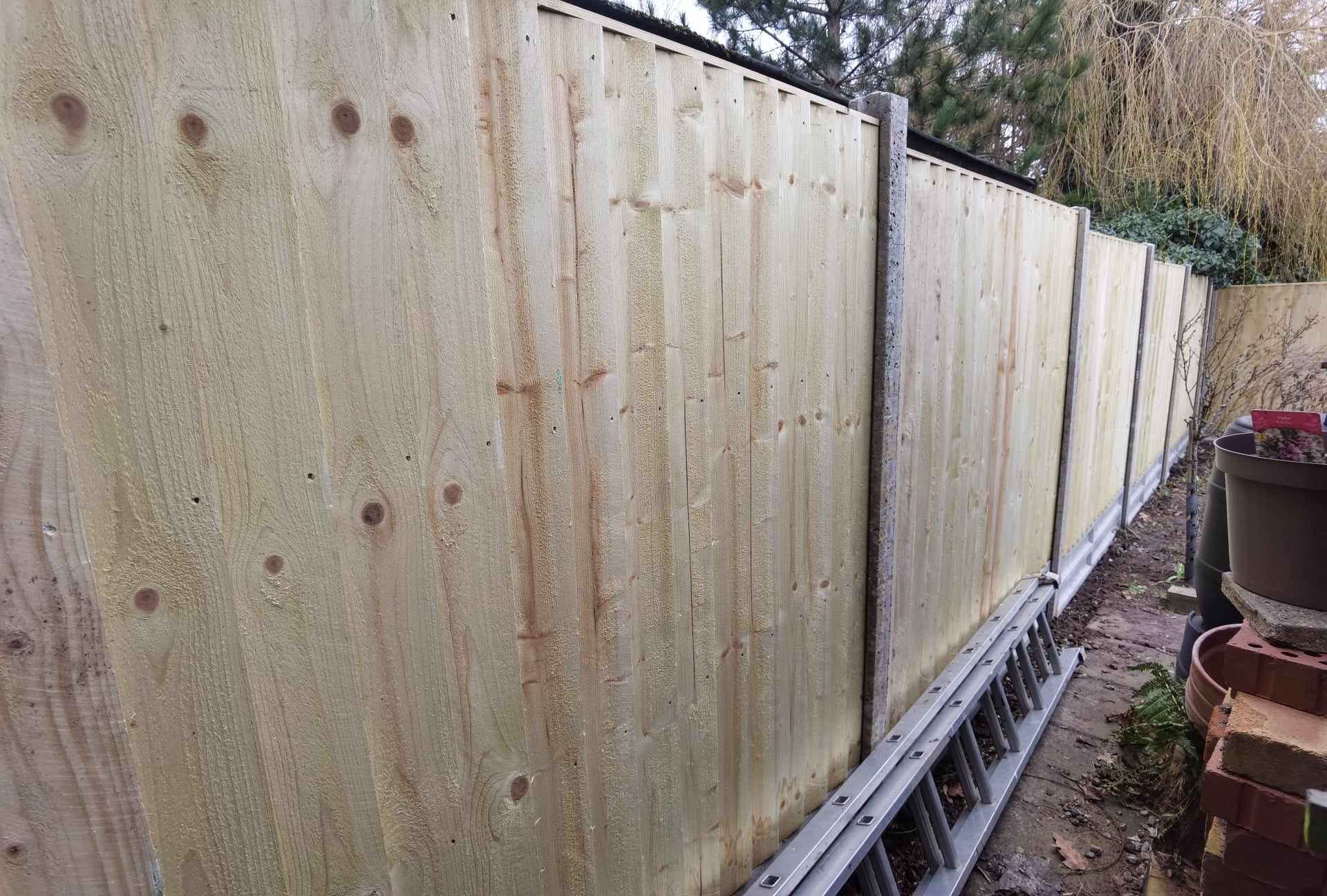 Fencing & gates Suffolk — New wooden fence panels installed with metal framework and posts
