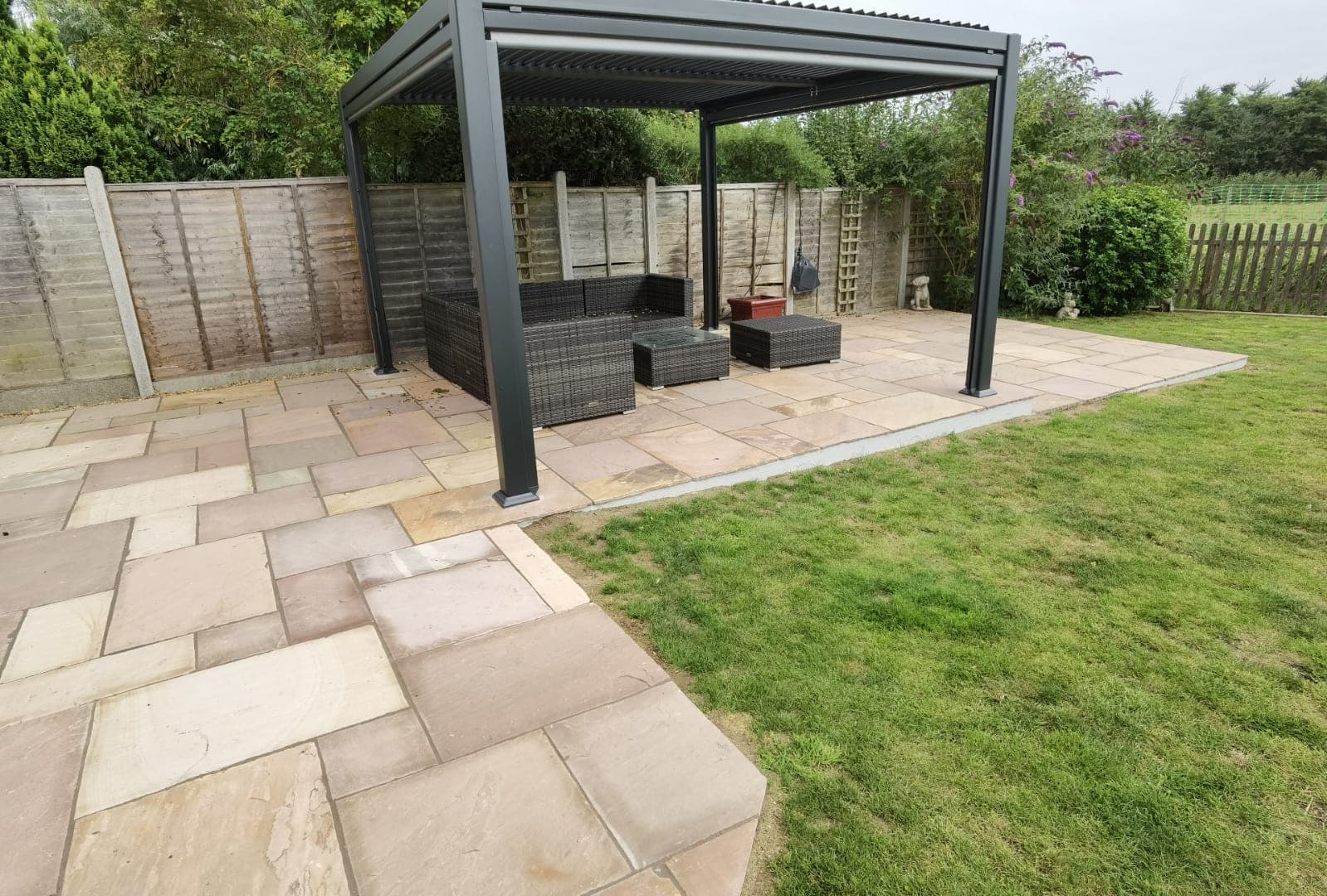 Garden landscaping project Suffolk — Complete finished garden with patio, pergola, furniture, fencing and lawn