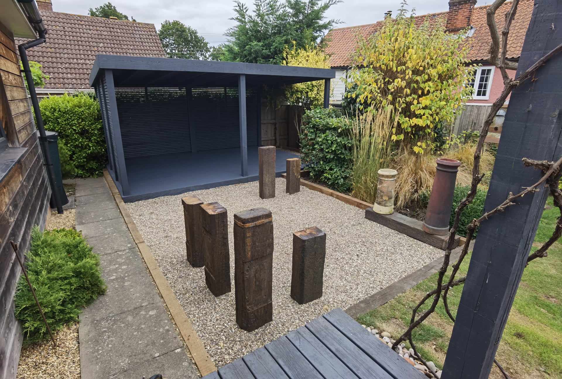 Garden landscaping project Suffolk — Finished garden space with patio, garden room, decking, and landscaping features