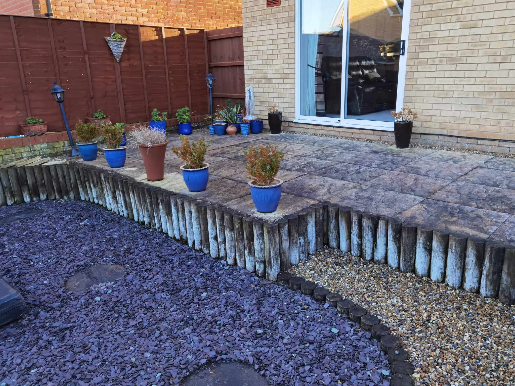 Garden landscaping project Suffolk — Finished courtyard garden with patio, planting, fencing and landscaping elements