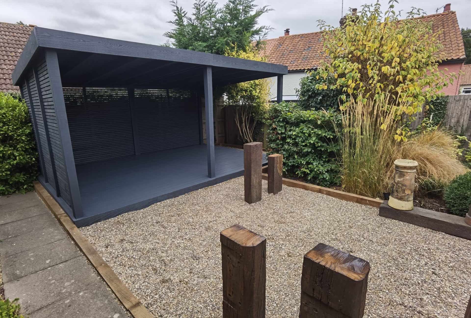 Garden landscaping project Suffolk — Contemporary garden space with pergola, gravel patio, and landscaping features
