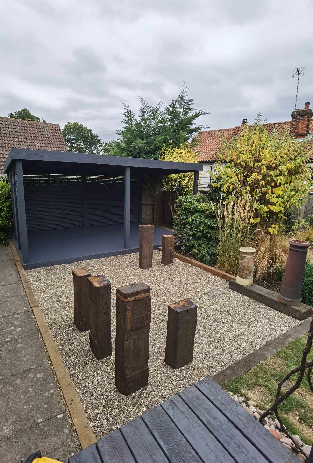 Garden landscaping project Suffolk — Finished garden space with pergola, decking, gravel patio, and landscaping