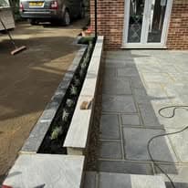Patio installation Suffolk — Newly installed porcelain paved patio with linear drainage channel