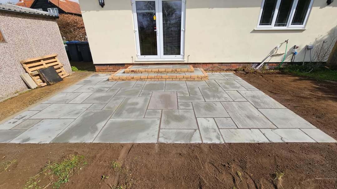 Patio installation Suffolk — Large stone slab patio with grey porcelain pavers in herringbone pattern