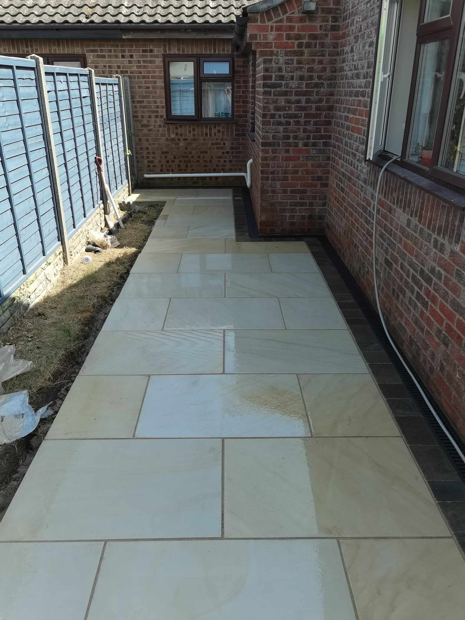 Patio installation Suffolk — Newly laid Indian sandstone patio in enclosed courtyard area