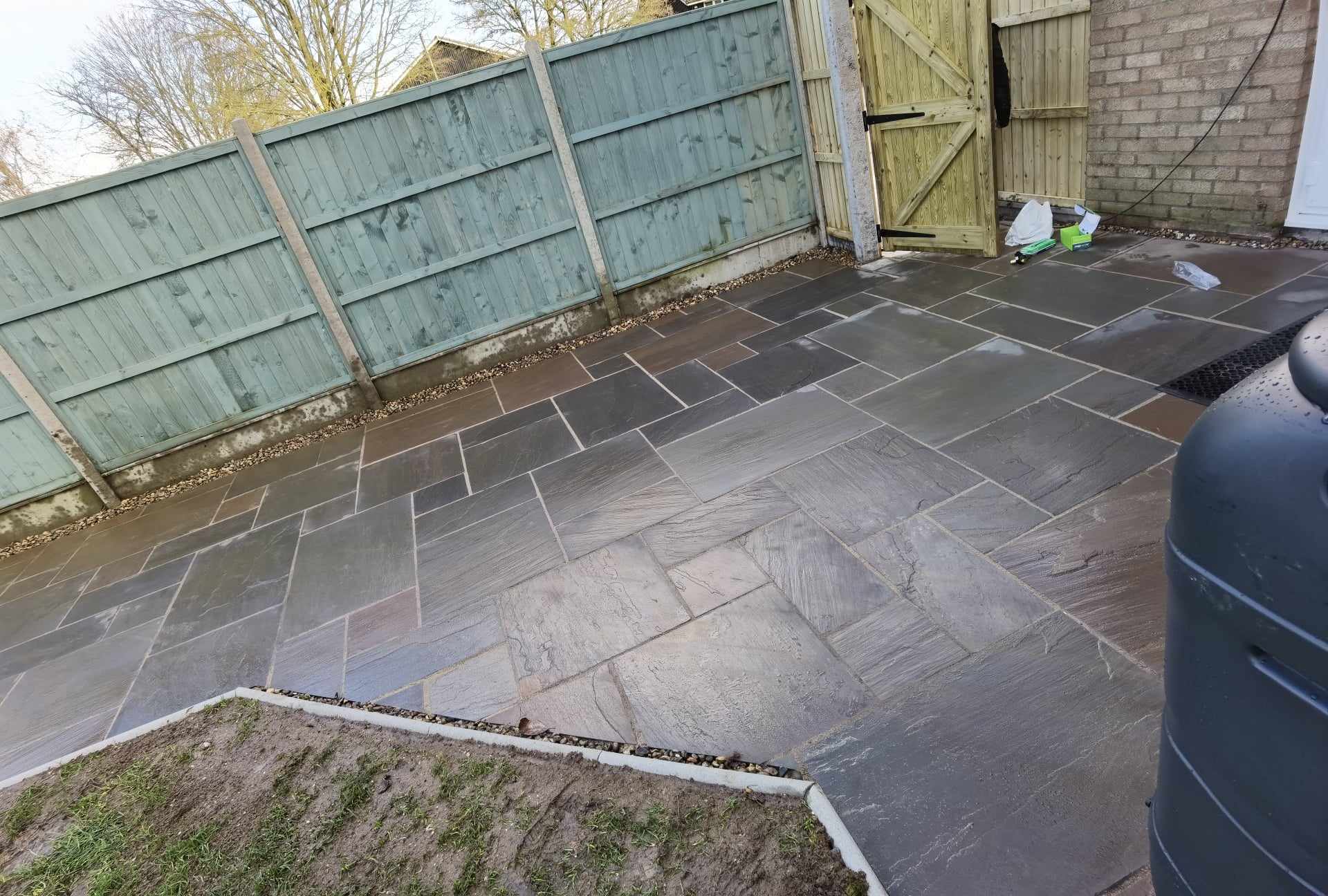 Patio installation Suffolk — Slate paved patio with herringbone pattern layout in garden