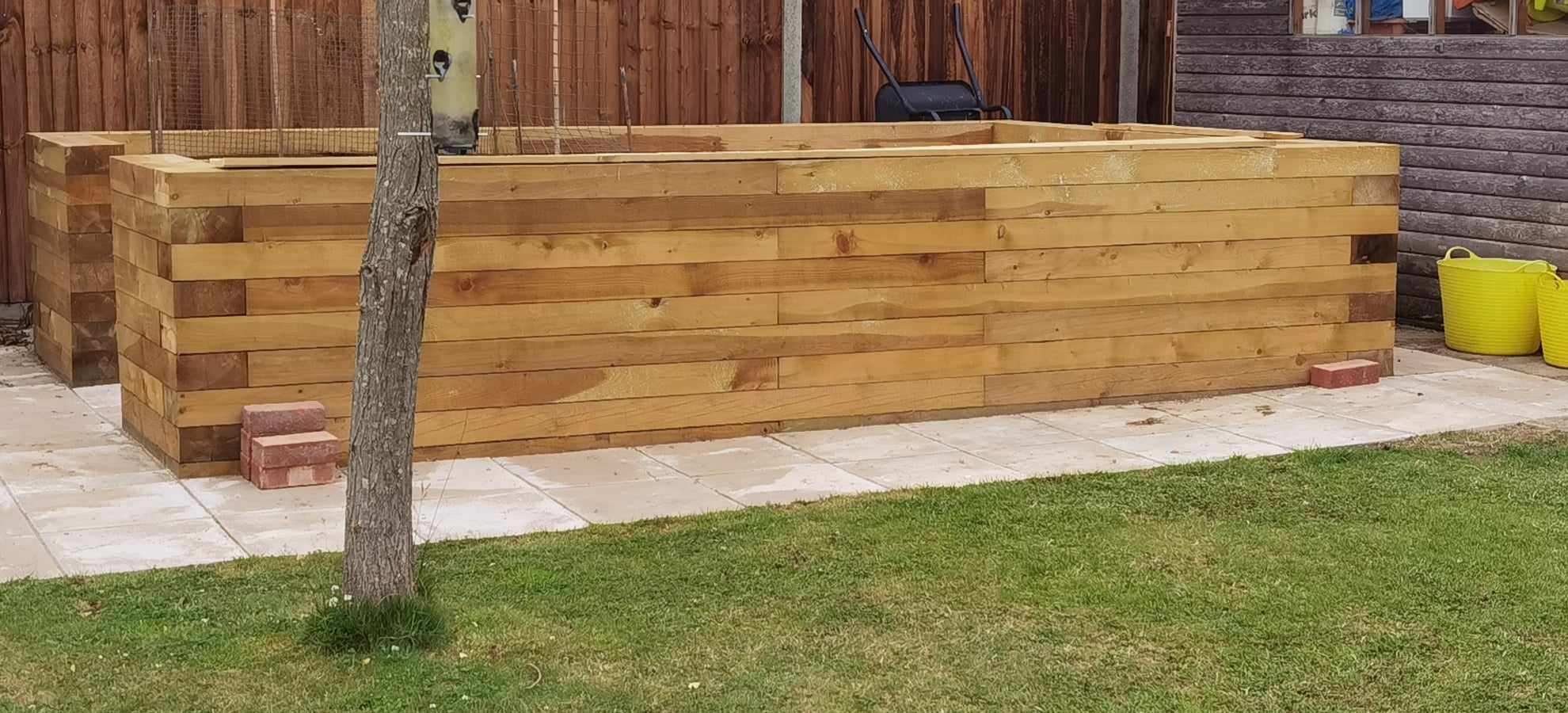 Raised bed garden Suffolk — Large wooden raised garden beds with patio and lawn surroundings