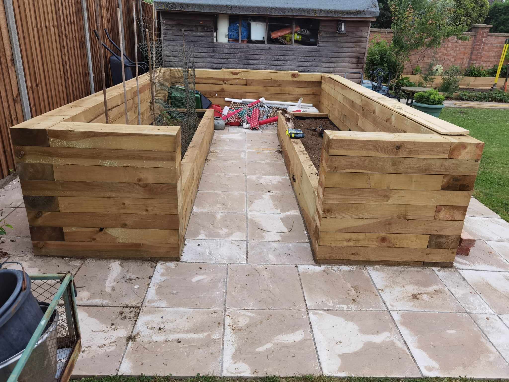 Raised bed garden Suffolk — Wooden raised garden beds under construction with patio base